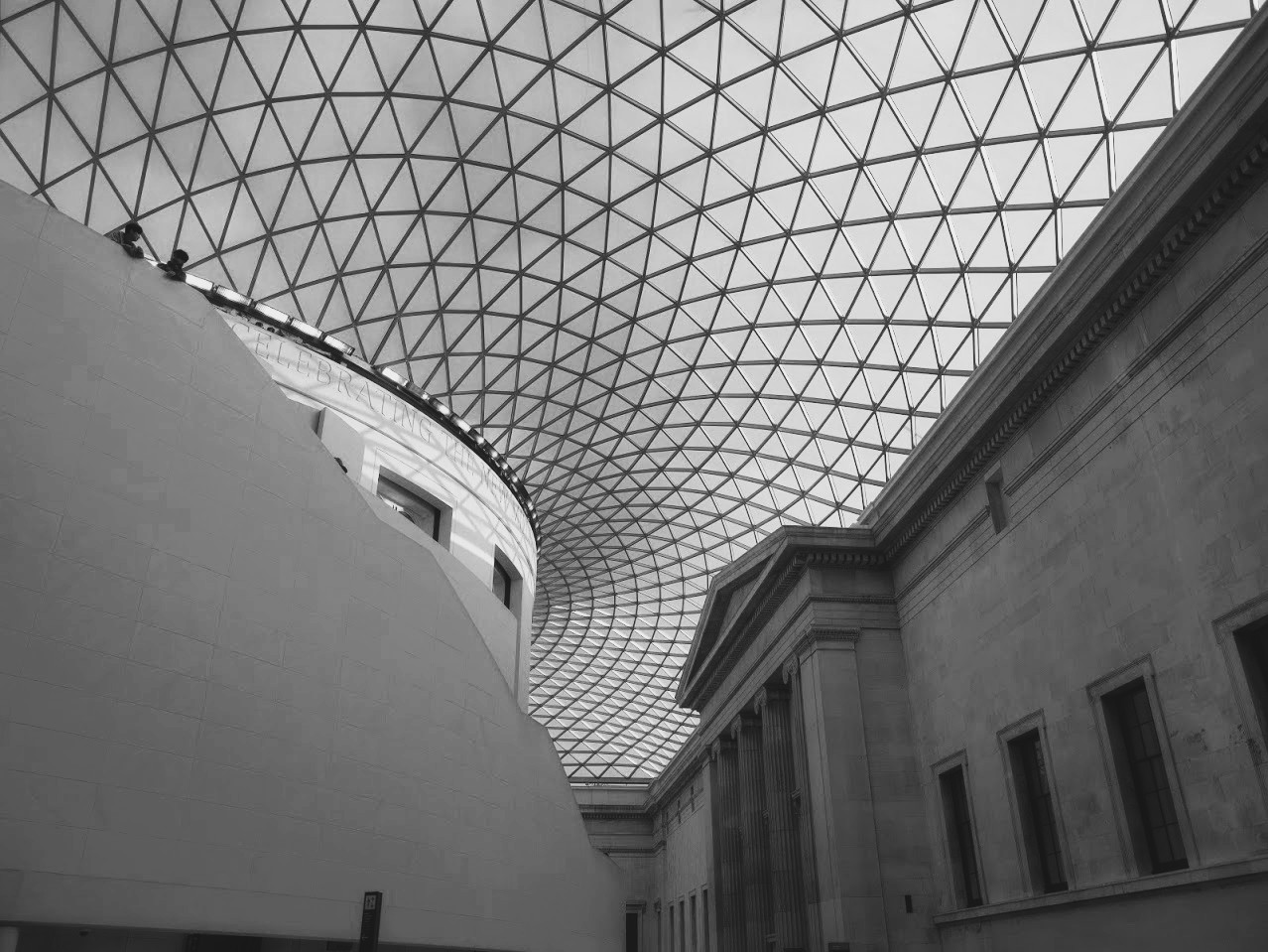 Black-and-white photograph of a museum's glass roof and courtyard